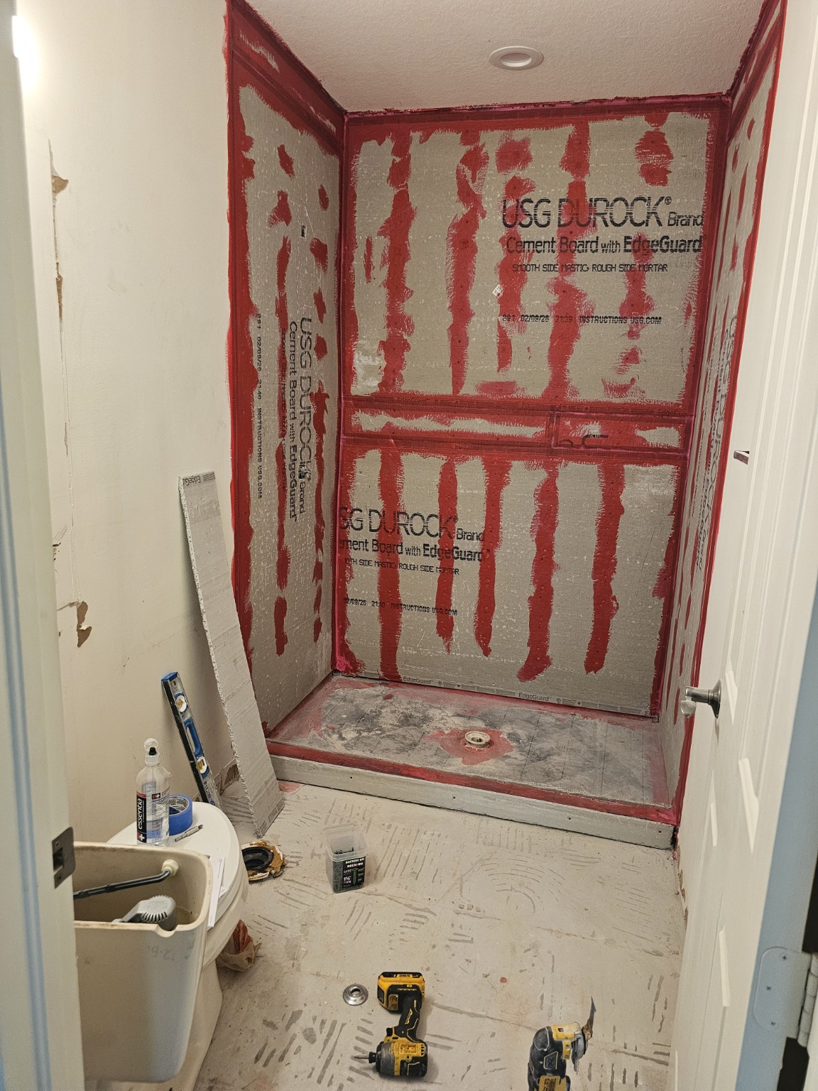Shower area rebuilt with cement board and waterproofed seams